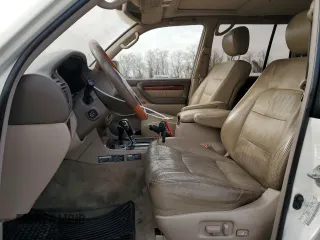 2000 Lexus LX 470 z VIN JT6HT00W8Y0126253, wystawiony jako Copart lot #49400665 z przebiegiem 181 328 mil mil oraz Szkody całkowita. Historia ofert i sprzedaży dostępna na DreamBid. Obrazek 7.