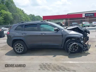 2020 Jeep Cherokee Trailhawk with VIN 1C4PJMBX5LD530720, listed as a IAAI auction lot 42404948 with 99,606 mi miles and . Bid and sale history available at DreamBid. Image 13.