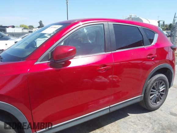 2019 Mazda CX-5 Touring with VIN JM3KFACM5K1516242, listed as a IAAI auction lot 42019803 with 113,953 mi miles. Bid and sale history available at carsss.com. Image 14.