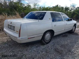 1999 Cadillac DeVille with VIN 1G6KD54Y2XU785069, listed as a IAAI auction lot 41630447 with 137,007 mi miles. Bid and sale history available at carsss.com. Image 4.