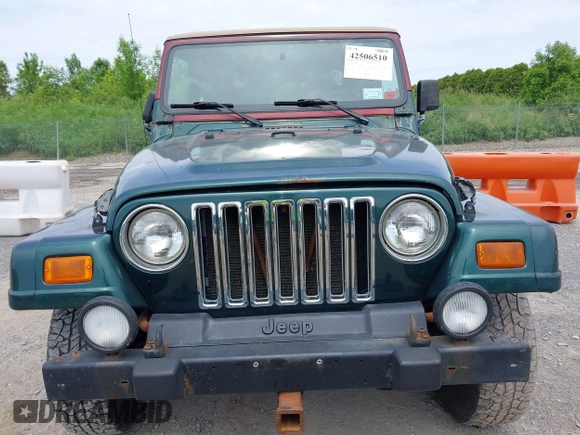1999 Jeep Wrangler Sahara z VIN 1J4FY49S7XP442719, wystawiony jako IAAI lot #42506510 z przebiegiem 188 175 mil mil oraz . Historia ofert i sprzedaży dostępna na DreamBid. Obrazek 6.