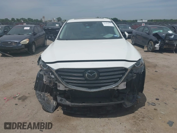 2021 Mazda CX-9 Touring with VIN JM3TCACY9M0526376, listed as a IAAI auction lot 42264478 with 74,671 mi miles and . Bid and sale history available at DreamBid. Image 12.