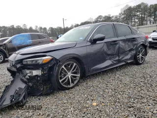 2024 Honda Civic Sedan Touring with VIN 2HGFE1F97RH329697, listed as a Copart auction lot 47434715 with 9,533 mi miles and Salvage Title. Bid and sale history available at carsss.com. Image 1.