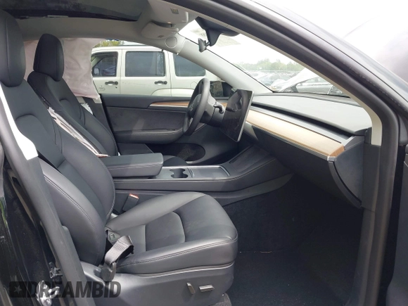 2023 Tesla Model Y Long Range with VIN 7SAYGAEE8PF928923, listed as a IAAI auction lot 41880988 with 18,468 mi miles. Bid and sale history available at carsss.com. Image 5.