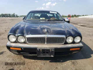 1996 Jaguar XJ with VIN SAJKX6747TC764559, listed as a Copart auction lot 48501775 with Not provided miles and Salvage title. Bid and sale history available at DreamBid. Image 5.