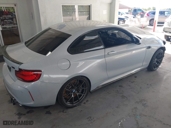 2020 BMW M2 Competition with VIN WBS2U7C01L7F87723, listed as a IAAI auction lot 40319156 with 55,309 mi miles. Bid and sale history available at carsss.com. Image 4.
