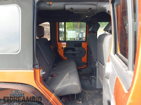 2010 Jeep Wrangler Unlimited Sport with VIN 1J4HA3H1XAL189667, listed as a IAAI auction lot 42062351 with 144,838 mi miles. Bid and sale history available at carsss.com. Image 8.