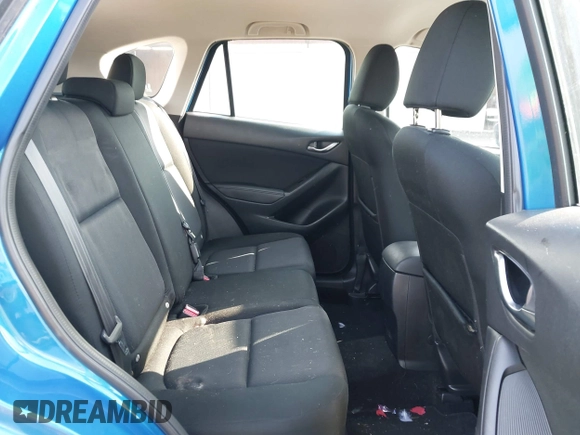 2014 Mazda CX-5 Sport z VIN JM3KE4BE7E0351982, wystawiony jako IAAI lot #42767499 z przebiegiem 154 774 mil mil oraz . Historia ofert i sprzedaży dostępna na DreamBid. Obrazek 8.