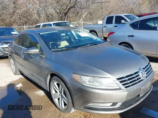 2014 Volkswagen CC Sport with VIN WVWBN7AN1EE518559, listed as a IAAI auction lot 41208853 with 154,957 mi miles. Bid and sale history available at carsss.com. Image 1.