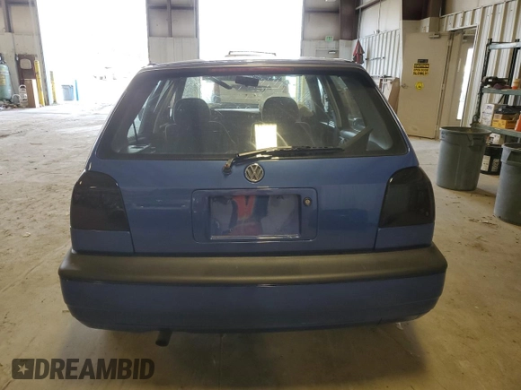 1996 Volkswagen Golf z VIN 3VWFA81H1TM066758, wystawiony jako Copart lot #41832035 z przebiegiem Nie podano mil oraz Szkoda całkowita • Salvage title. Historia ofert i sprzedaży dostępna na DreamBid. Obrazek 6.