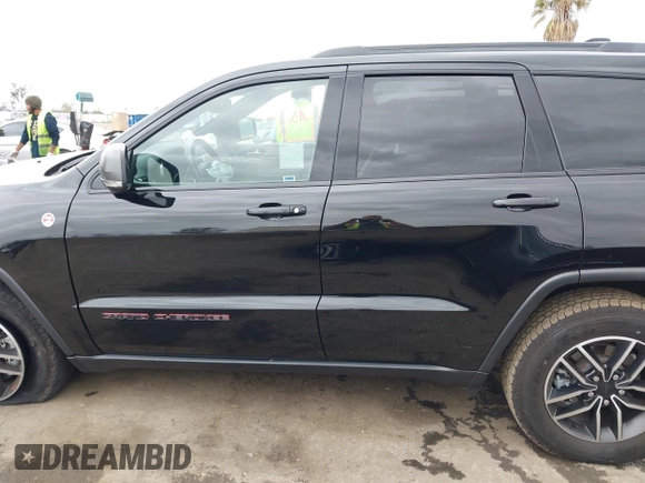 2021 Jeep Grand Cherokee Trailhawk with VIN 1C4RJFLT4MC771773, listed as a IAAI auction lot 42063954 with 17,920 mi miles and . Bid and sale history available at DreamBid. Image 14.