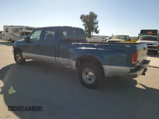 2000 Ford F-350 with VIN 1FTWW32S9YED99031, listed as a Copart auction lot 75952254 with 220,673 mi miles and Salvage title. Bid and sale history available at DreamBid. Image 2.