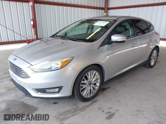 2017 Ford Focus Titanium z VIN 1FADP3N2XHL288103, wystawiony jako IAAI lot #42573844 z przebiegiem 128 952 mil mil oraz . Historia ofert i sprzedaży dostępna na DreamBid. Obrazek 2.