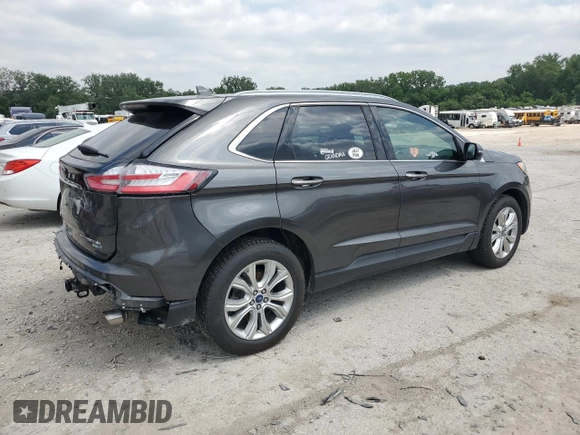 2020 Ford Edge Titanium с VIN 2FMPK4K97LBA11619, выставлен на аукционе Copart как лот 59505825 с пробегом 87 506 миль миль и Списание • Salvage title. История ставок и продаж доступна на DreamBid. Изображение 3.