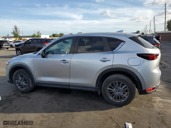 2021 Mazda CX-5 Touring with VIN JM3KFACM5M1327402, listed as a Copart auction lot 46286615 with 33,638 mi miles and Clean Title. Bid and sale history available at carsss.com. Image 2.