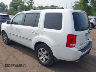 2011 Honda Pilot Touring z VIN 5FNYF4H9XBB003469, wystawiony jako IAAI lot #42369323 z przebiegiem 201 958 mil mil oraz . Historia ofert i sprzedaży dostępna na DreamBid. Obrazek 3.