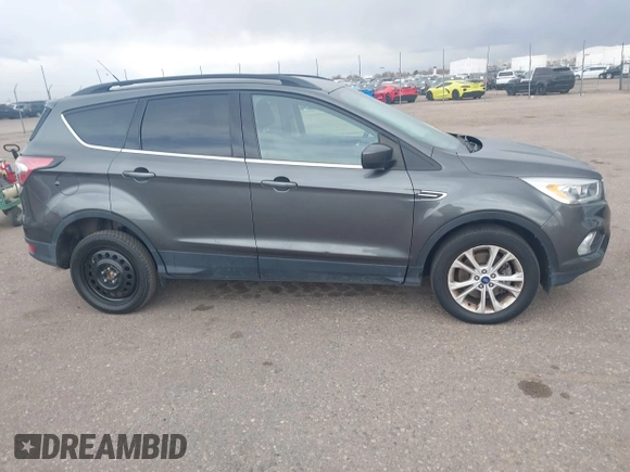 2017 Ford Escape SE with VIN 1FMCU9GD1HUB46034, listed as a IAAI auction lot 41840906 with 143,806 mi miles. Bid and sale history available at carsss.com. Image 13.