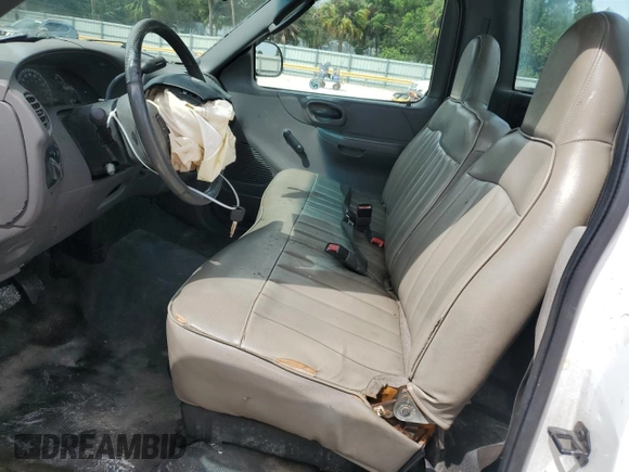 2002 Ford F-150 XL with VIN 1FTRF17W32NB86385, listed as a Copart auction lot 73276754 with 100,817 mi miles and Salvage Title. Bid and sale history available at carsss.com. Image 7.