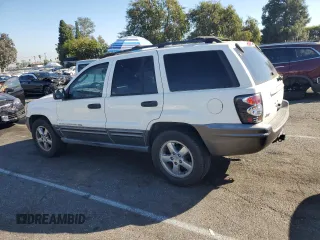 2004 Jeep Grand Cherokee with VIN 1J4GX48JX4C301369, listed as a Copart auction lot 77803094 with 179,404 mi miles and Clean title. Bid and sale history available at DreamBid. Image 2.