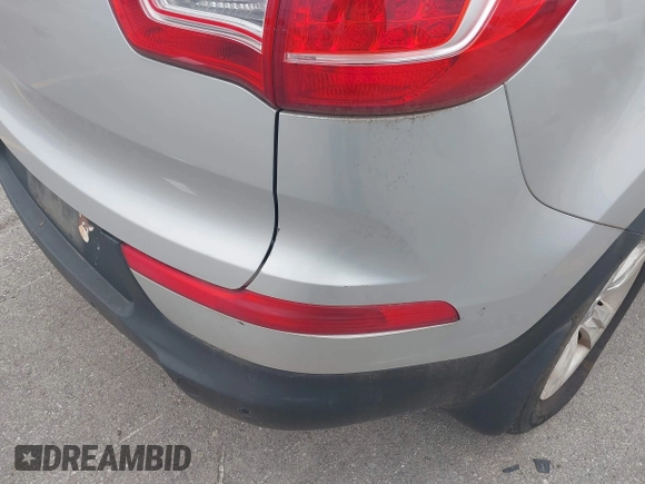 2012 Kia Sportage LX with VIN KNDPBCA24C7214432, listed as a IAAI auction lot 42530116 with 127,623 mi miles and . Bid and sale history available at DreamBid. Image 12.