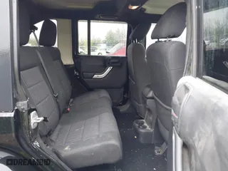 2011 Jeep Wrangler Unlimited Sahara with VIN 1J4BA5H12BL548870, listed as a IAAI auction lot 42010303 with 139,693 mi miles. Bid and sale history available at carsss.com. Image 8.