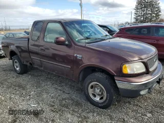 2000 Ford F-150 XL with VIN 1FTRX18WXYNB79888, listed as a Copart auction lot 46323685 with 143,904 mi miles and Salvage Title. Bid and sale history available at carsss.com. Image 4.