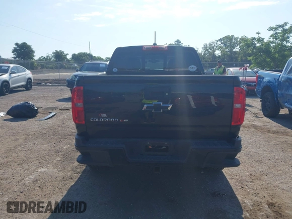 2020 Chevrolet Colorado 2WD Z71 z VIN 1GCGSDEN2L1122555, wystawiony jako IAAI lot #42096724 z przebiegiem 120 679 mil mil oraz . Historia ofert i sprzedaży dostępna na DreamBid. Obrazek 16.