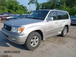 2001 Toyota Land Cruiser z VIN JTEHT05J912007249, wystawiony jako IAAI lot #42409963 z przebiegiem 303 292 mil mil oraz . Historia ofert i sprzedaży dostępna na DreamBid. Obrazek 2.
