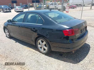 2014 Volkswagen Jetta TDI w/Premium with VIN 3VW3L7AJ6EM420044, listed as a IAAI auction lot 42569620 with 143,482 mi miles and . Bid and sale history available at DreamBid. Image 3.