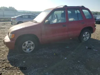 1999 Kia Sportage with VIN KNDJA7237X5597517, listed as a Copart auction lot 82673504 with 114,236 mi miles and Salvage title. Bid and sale history available at DreamBid. Image 1.