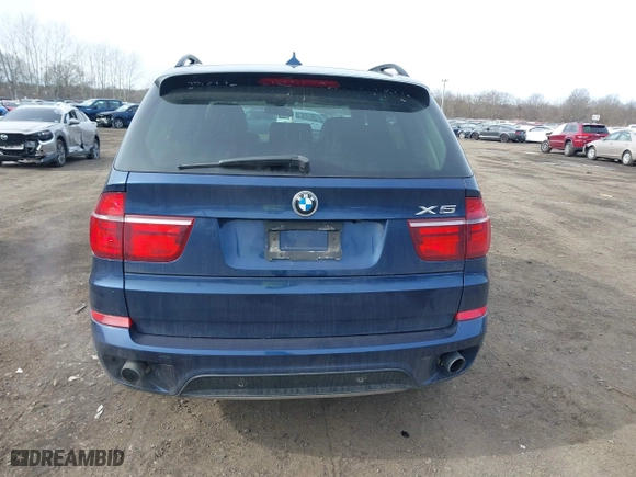 2011 BMW X5 35i with VIN 5UXZV4C56BL412415, listed as a IAAI auction lot 41611847 with 141,848 mi miles. Bid and sale history available at carsss.com. Image 16.