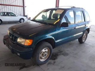 2000 Kia Sportage with VIN KNDJB7232Y5651398, listed as a IAAI auction lot 41678617 with 156,144 mi miles. Bid and sale history available at carsss.com. Image 2.
