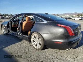 2013 Jaguar XJ with VIN SAJWA2GB0DLV43865, listed as a Copart auction lot 79693934 with 0 mi miles and Salvage Title. Bid and sale history available at carsss.com. Image 2.