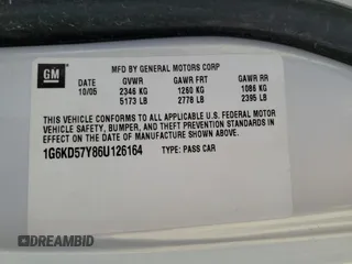2006 Cadillac DTS 1SB z VIN 1G6KD57Y86U126164, wystawiony jako Copart lot #52686965 z przebiegiem 153 426 mil mil oraz Szkoda całkowita • Salvage title. Historia ofert i sprzedaży dostępna na DreamBid. Obrazek 12.