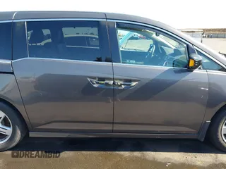 2012 Honda Odyssey Touring with VIN 5FNRL5H95CB057346, listed as a IAAI auction lot 42644094 with 114,712 mi miles and . Bid and sale history available at DreamBid. Image 14.