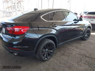 2017 BMW X6 xDrive35i with VIN 5UXKU2C56H0N85080, listed as a IAAI auction lot 41955473 with 142,201 mi miles. Bid and sale history available at carsss.com. Image 4.