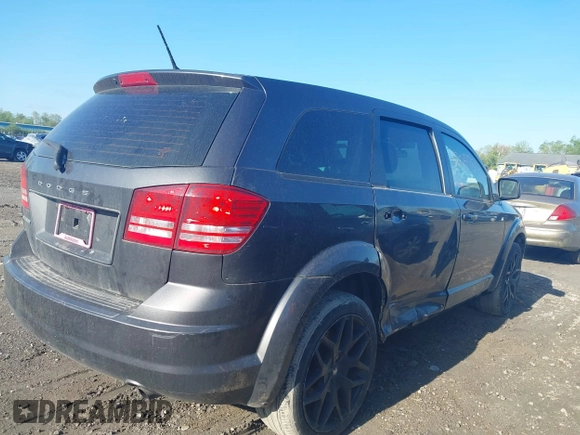 2015 Dodge Journey SE z VIN 3C4PDCAB4FT675074, wystawiony jako IAAI lot #42059878 z przebiegiem 99 947 mil mil oraz . Historia ofert i sprzedaży dostępna na DreamBid. Obrazek 4.