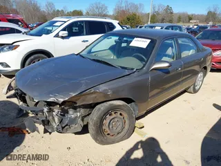 1999 Mazda 626 LX with VIN 1YVGF22D8X5871485, listed as a IAAI auction lot 41641049 with 115,603 mi miles. Bid and sale history available at carsss.com. Image 2.
