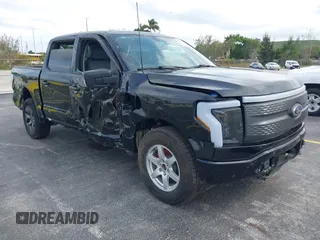 2023 Ford F-150 Lightning Pro with VIN 1FTVW1ELXPWG15885, listed as a IAAI auction lot 41631871 with 88,151 mi miles. Bid and sale history available at carsss.com. Image 1.