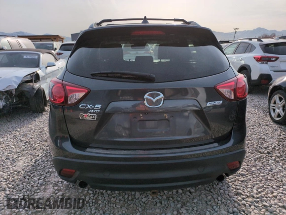 2015 Mazda CX-5 Grand Touring with VIN JM3KE4DY3F0495411, listed as a Copart auction lot 50077765 with 136,191 mi miles and Salvage Title. Bid and sale history available at DreamBid. Image 6.