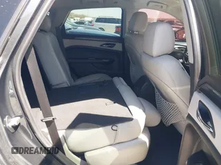2014 Cadillac SRX z VIN 3GYFNAE35ES610751, wystawiony jako IAAI lot #41832296 z przebiegiem 133 293 mil mil oraz . Historia ofert i sprzedaży dostępna na DreamBid. Obrazek 8.