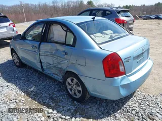 2007 Hyundai Accent GLS with VIN KMHCN46C57U159120, listed as a IAAI auction lot 42021811 with 114,564 mi miles. Bid and sale history available at carsss.com. Image 3.