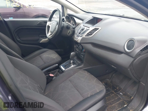 2013 Ford Fiesta SE z VIN 3FADP4BJ3DM142247, wystawiony jako IAAI lot #42337359 z przebiegiem 149 711 mil mil oraz . Historia ofert i sprzedaży dostępna na DreamBid. Obrazek 5.