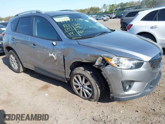 2014 Mazda CX-5 Touring with VIN JM3KE4CY0E0302583, listed as a IAAI auction lot 41947735 with 122,077 mi miles. Bid and sale history available at carsss.com. Image 1.