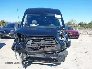 2016 Ford Transit Cargo z VIN 1FTYR2CM6GKB54374, wystawiony jako IAAI lot #41674672 z przebiegiem 128 594 mil mil oraz . Historia ofert i sprzedaży dostępna na DreamBid. Obrazek 13.