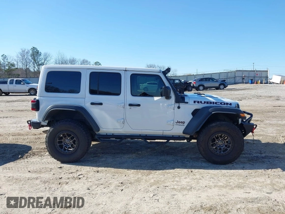 2022 Jeep Wrangler Unlimited Rubicon z VIN 1C4JJXFGXNW121489, wystawiony jako IAAI lot #41749550 z przebiegiem 56 601 mil mil oraz . Historia ofert i sprzedaży dostępna na DreamBid. Obrazek 14.
