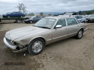 1997 Jaguar XJ Vanden Plas with VIN SAJKX6245VC800386, listed as a Copart auction lot 53651675 with 158,185 mi miles and Salvage Title. Bid and sale history available at DreamBid. Image 1.