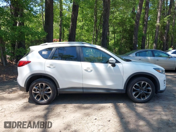 2016 Mazda CX-5 Grand Touring with VIN JM3KE2DY0G0870077, listed as a IAAI auction lot 42158225 with 93,816 mi miles. Bid and sale history available at carsss.com. Image 13.