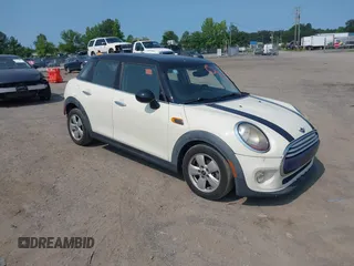 2015 MINI Hardtop 4 Door with VIN WMWXS5C5XFT827330, listed as a IAAI auction lot 42402965 with 140,648 mi miles and . Bid and sale history available at DreamBid. Image 1.