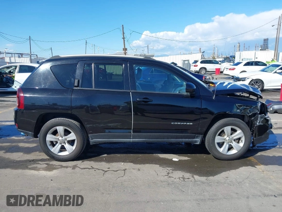 2016 Jeep Compass Latitude with VIN 1C4NJCEB2GD628384, listed as a IAAI auction lot 41752694 with 122,589 mi miles. Bid and sale history available at carsss.com. Image 13.